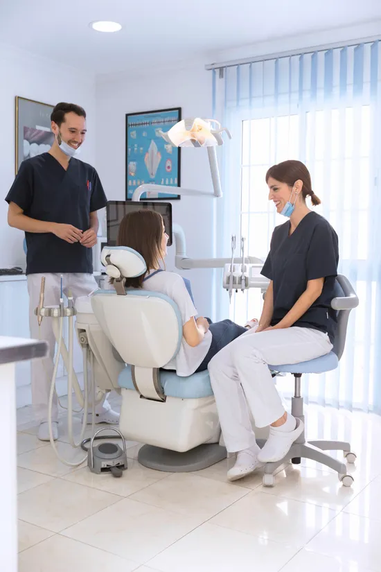 Bender Dental Associates team with a patient